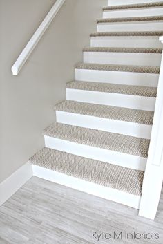 Stairs with carpet herringbone treads and painted white risers, looks like  a runner. Benjamin